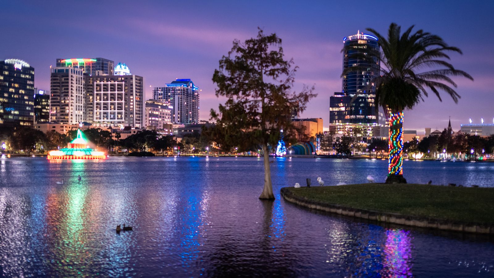 Downtown Orlando skyline over Lake Eola at twilight